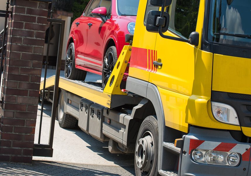 red car in the towing truck