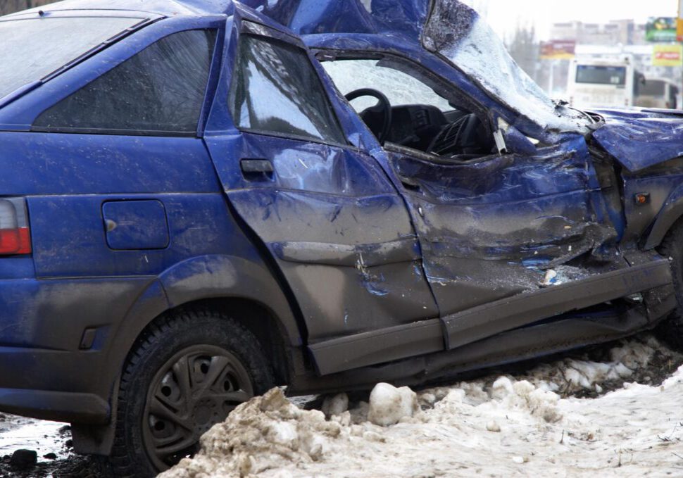 damaged blue car near